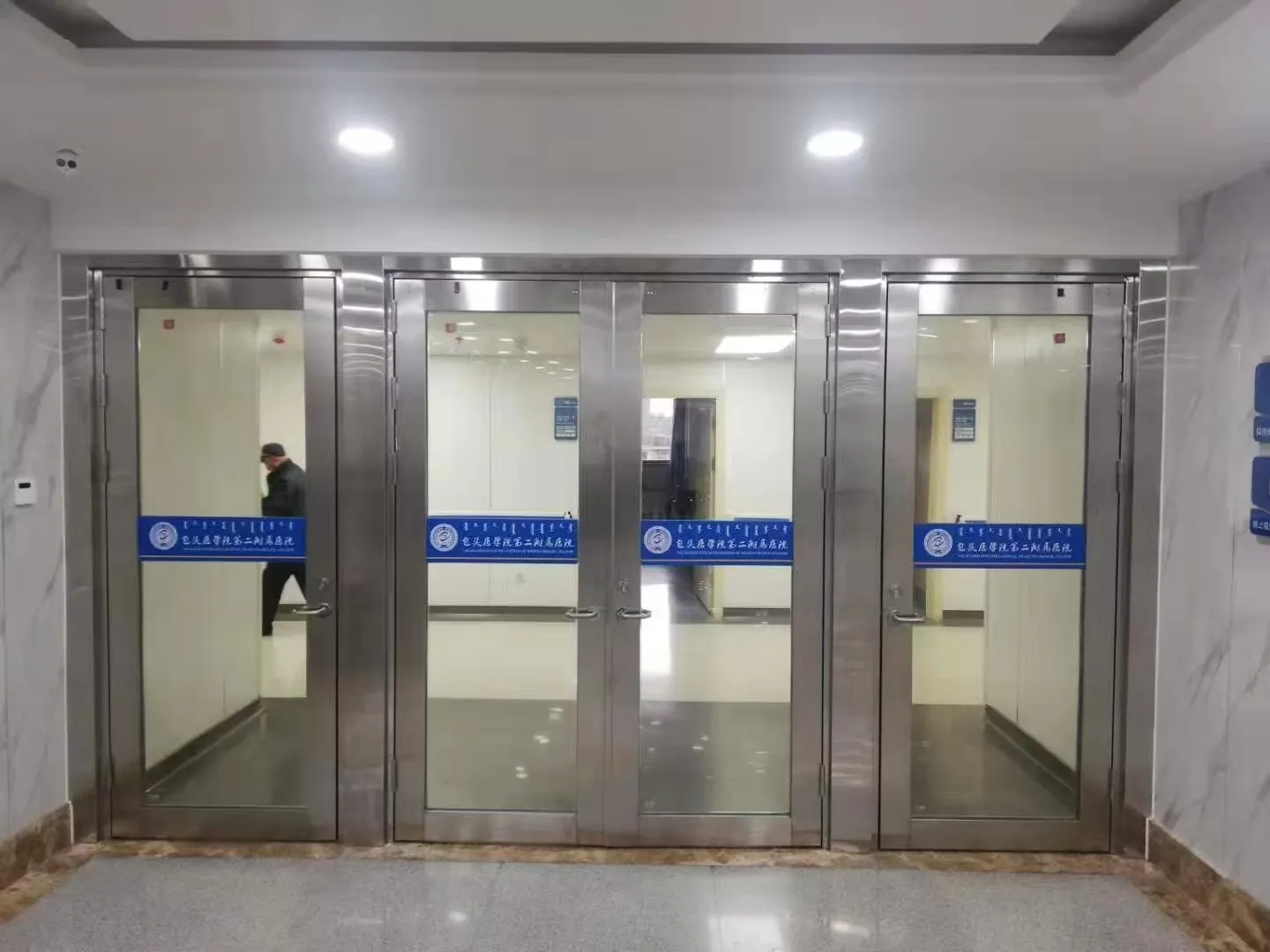 Fire door vision panel with tested fire-rated glass and intumescent seals